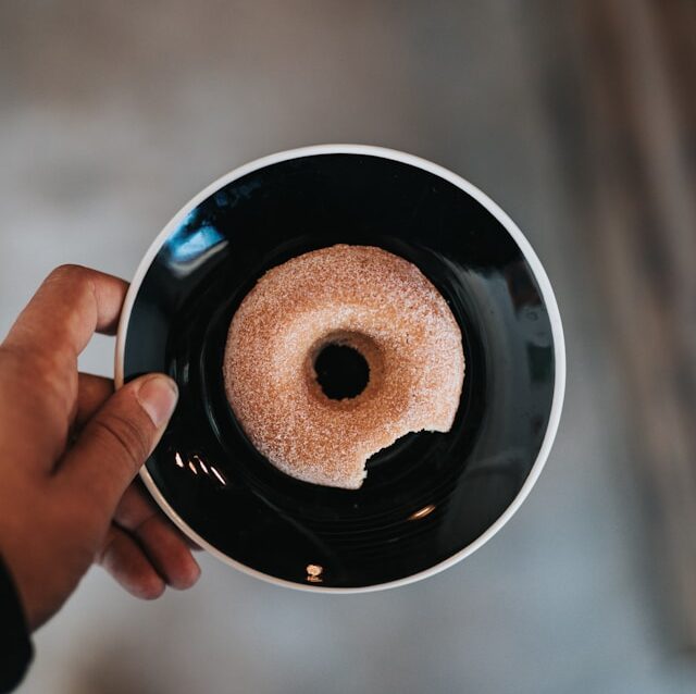 Unsplash-nathan-dumlao-donut-doughnut bite-640x960